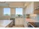 Kitchen features granite countertops, stainless appliances and eat in breakfast area with gulf views at 1170 Gulf Blvd # 402, Clearwater, FL 33767