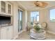 Living area with wet bar and sliding glass doors to the balcony at 1170 Gulf Blvd # 402, Clearwater, FL 33767