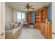 Inviting office featuring built-in bookshelves, a comfortable sofa, and beautiful views at 1170 Gulf Blvd # 402, Clearwater, FL 33767