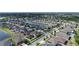 Aerial view of a residential community with a lake and well maintained lawns at 11720 Navajo Sandstone St, Riverview, FL 33579