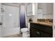Standard bathroom featuring a shower-tub combo, granite sink, and vanity cabinet at 11720 Navajo Sandstone St, Riverview, FL 33579