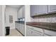 Convenient butler's pantry with granite counters and ample cabinet storage space at 11720 Navajo Sandstone St, Riverview, FL 33579
