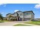 Beautiful two-story home with well-manicured lawn, brick driveway, and two-car garage at 11720 Navajo Sandstone St, Riverview, FL 33579
