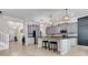 Stunning kitchen featuring gray cabinets, granite counters, stainless appliances, and large island at 11720 Navajo Sandstone St, Riverview, FL 33579