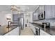 Spacious kitchen with granite countertops, stainless steel appliances, and ample cabinet space at 11720 Navajo Sandstone St, Riverview, FL 33579