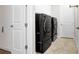 Functional laundry room with modern washer, dryer, and ample storage at 11720 Navajo Sandstone St, Riverview, FL 33579
