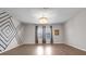 Spacious living room with hardwood floors, modern lighting, and decorative wall design at 11720 Navajo Sandstone St, Riverview, FL 33579