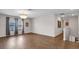 Open living room with hard wood floors, lots of light and staircase at 11720 Navajo Sandstone St, Riverview, FL 33579