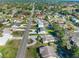 A bird's eye view shows the property amidst a lush, green neighborhood at 11780 Linden Dr, Spring Hill, FL 34608