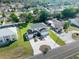 Aerial view of the home with mature trees, fenced-in yard, and convenient street access at 11780 Linden Dr, Spring Hill, FL 34608