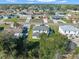 Spacious suburban home with green lawns, a quiet street, and beautiful mature trees in the surrounding landscape at 11780 Linden Dr, Spring Hill, FL 34608