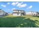 Backyard of the home featuring green lawn and a wooden deck at 11780 Linden Dr, Spring Hill, FL 34608