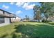 Spacious backyard with well-maintained green lawn at 11780 Linden Dr, Spring Hill, FL 34608