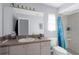 A functional bathroom with a shower/tub combo, toilet, and vanity at 11780 Linden Dr, Spring Hill, FL 34608