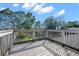 Wooden deck featuring views of trees and the surrounding yard at 11780 Linden Dr, Spring Hill, FL 34608