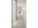 Hallway with tiled flooring leading to the kitchen and living areas at 11780 Linden Dr, Spring Hill, FL 34608