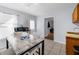 Cozy kitchenette featuring a marble table, white chairs, and sink area at 11780 Linden Dr, Spring Hill, FL 34608