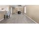 Spacious living room with tile flooring, a fireplace, and built-in shelving at 11780 Linden Dr, Spring Hill, FL 34608