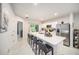 Modern kitchen with an island, stainless steel appliances, and an open floor plan at 12264 Grizzly Ln, New Port Richey, FL 34654