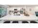 Modern kitchen with a large island, stainless steel appliances and white cabinetry at 12264 Grizzly Ln, New Port Richey, FL 34654