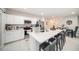 Modern kitchen with a large island and barstool seating at 12264 Grizzly Ln, New Port Richey, FL 34654