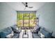 Cozy sunroom with comfortable seating and a view of the natural landscape at 12264 Grizzly Ln, New Port Richey, FL 34654