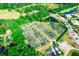 Community aerial view featuring lush landscaping, ponds, and nearby golf course at 1257 Lyndhurst Greens Dr, Sun City Center, FL 33573