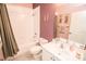 Cozy bathroom with a bathtub and shower, a toilet, and a sink with vanity and a mirror at 1257 Lyndhurst Greens Dr, Sun City Center, FL 33573