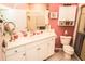 Bright bathroom with a large vanity, white cabinets, and a walk-in shower with glass door at 1257 Lyndhurst Greens Dr, Sun City Center, FL 33573