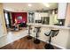 Stylish kitchen featuring modern stainless-steel appliances, a breakfast bar, and an adjacent dining area at 1257 Lyndhurst Greens Dr, Sun City Center, FL 33573