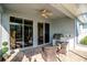Covered patio features a built-in outdoor kitchen with stainless steel grill and brick flooring at 1257 Lyndhurst Greens Dr, Sun City Center, FL 33573