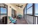 Enjoy stunning ocean views from the condo balcony with a dining set and comfortable seating at 13720 Gulf Blvd # 305, Madeira Beach, FL 33708