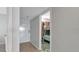 Hallway view to bedroom featuring bunk beds and carpet at 13720 Gulf Blvd # 305, Madeira Beach, FL 33708