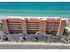 A full exterior view highlights the condo building and amenities, including easy beach access and parking at 13720 Gulf Blvd # 305, Madeira Beach, FL 33708