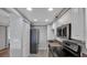 Updated kitchen offers stainless steel appliances, white cabinets, and ample storage space for cooking enthusiasts at 13720 Gulf Blvd # 305, Madeira Beach, FL 33708