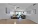 Light and airy living room and dining area with ocean views and access to a private balcony at 13720 Gulf Blvd # 305, Madeira Beach, FL 33708