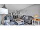 Open-concept living area with stylish décor, flows to dining space and kitchen at 13720 Gulf Blvd # 305, Madeira Beach, FL 33708