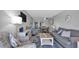 Inviting open-concept living space with comfortable seating and stylish decor throughout the condo at 13720 Gulf Blvd # 305, Madeira Beach, FL 33708
