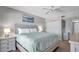 Relaxing bedroom with king-sized bed and closet with bedside lamps for a cozy atmosphere at 13720 Gulf Blvd # 305, Madeira Beach, FL 33708