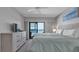 Bright bedroom offers ocean views, comfortable king-sized bed, and stylish furnishings at 13720 Gulf Blvd # 305, Madeira Beach, FL 33708