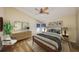 Relaxing bedroom with neutral tones, a ceiling fan, and a dresser at 1604 Storington Ave, Brandon, FL 33511