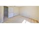 Empty bedroom showing an open door with view to another room at 1604 Storington Ave, Brandon, FL 33511