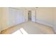 A clean bedroom with carpet and a double-door closet at 1604 Storington Ave, Brandon, FL 33511