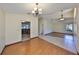 Open dining room features laminate flooring and a modern chandelier at 1604 Storington Ave, Brandon, FL 33511