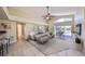 Bright living room with tile floors, modern furnishings, and access to the pool area at 1604 Storington Ave, Brandon, FL 33511