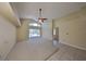 Bright living room features sliding doors to the pool at 1604 Storington Ave, Brandon, FL 33511
