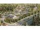 An aerial rendering highlights a planned community with gardens, homes, parking and green spaces at 17546 Happytrails St, Land O Lakes, FL 34638