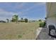 A spacious backyard featuring mature landscaping, creating a serene outdoor environment at 1809 Haverford Ave, Sun City Center, FL 33573