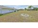 A spacious backyard extends from the home, offering ample space for outdoor activities at 1809 Haverford Ave, Sun City Center, FL 33573