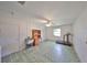 Spacious unfinished basement featuring a ceiling fan, a utility sink and plenty of room for storage at 1809 Haverford Ave, Sun City Center, FL 33573